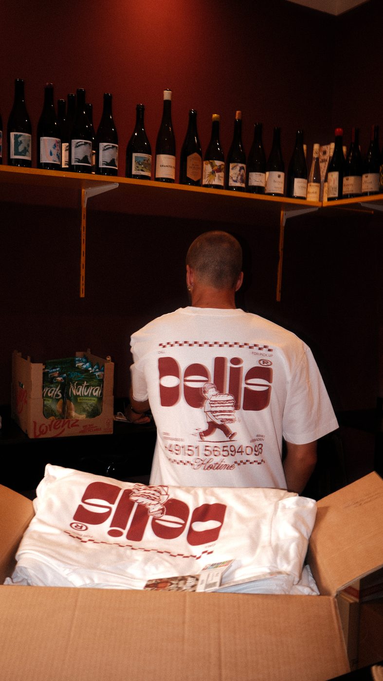 Back print of the shirt in the wine shelf corner