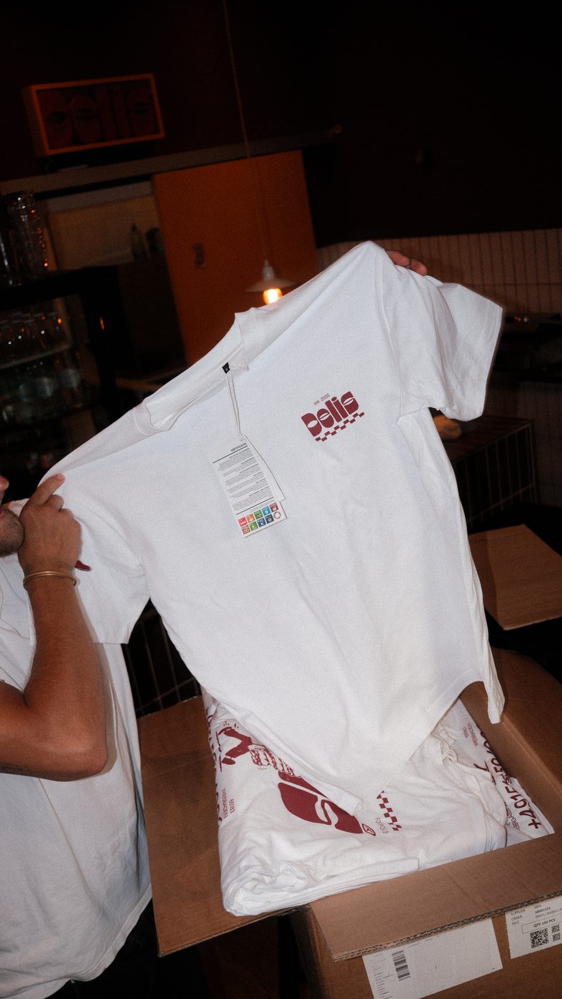 Shirt being pulled out of the box