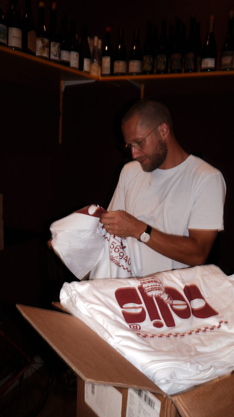 Folding through the stack of shirts