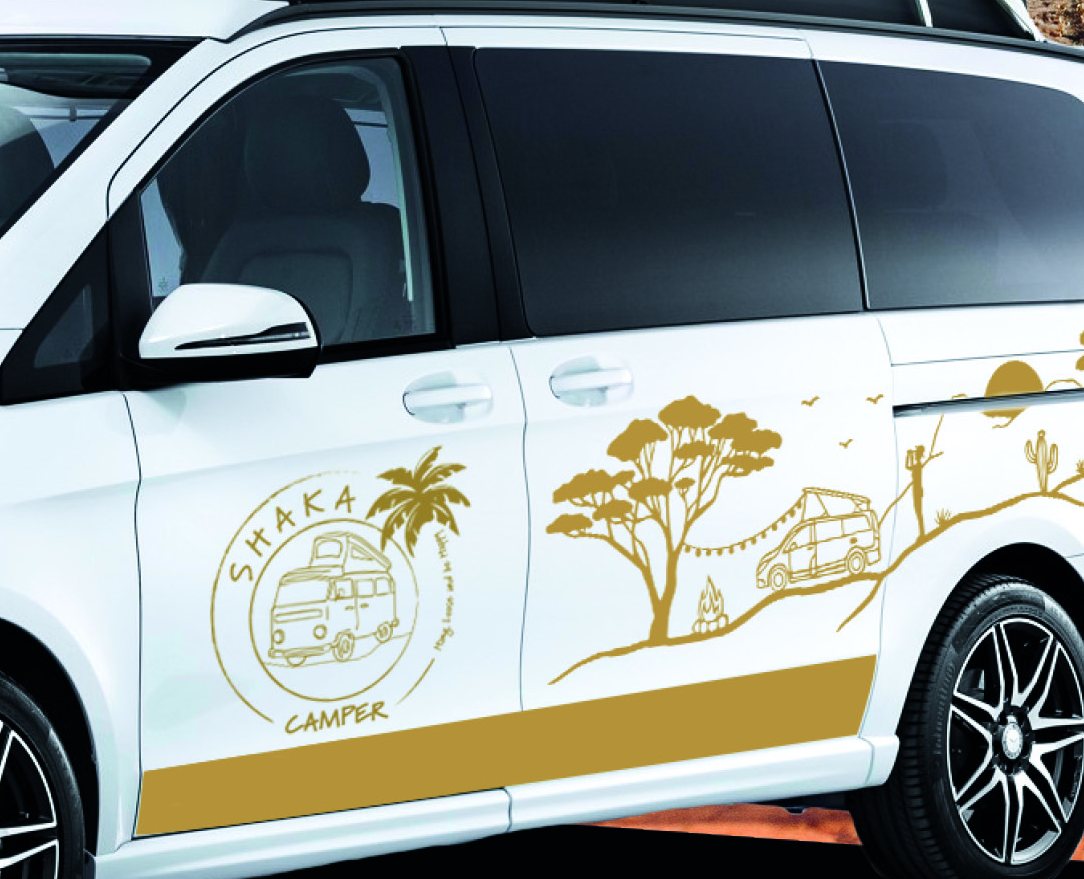 Van livery: palm trees and the Shaka Camper logo in gold on a white van